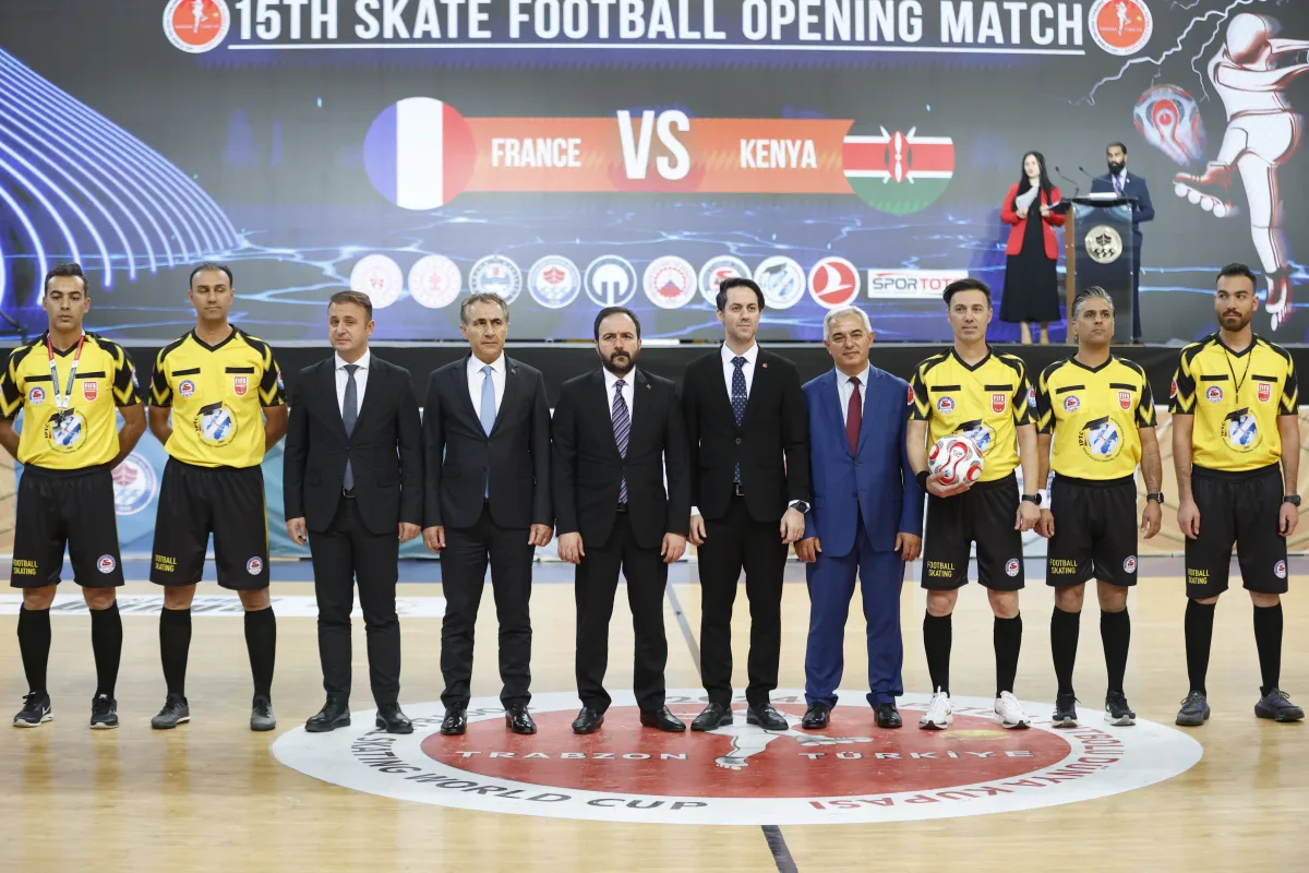National delegations seated at an official FIFS meeting on the Football Skating World Cup, with their national flags on the table